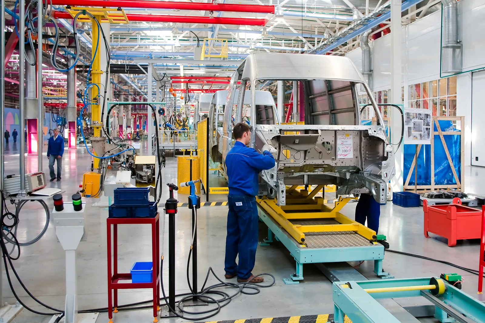 Workers on a vehicle manufacturing line
